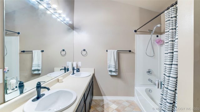 bathroom with vanity and shower / tub combo with curtain