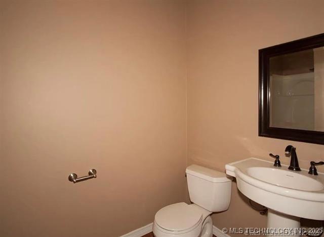 bathroom with toilet and sink