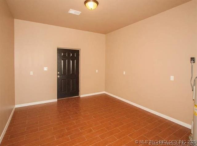 unfurnished room featuring wood-type flooring