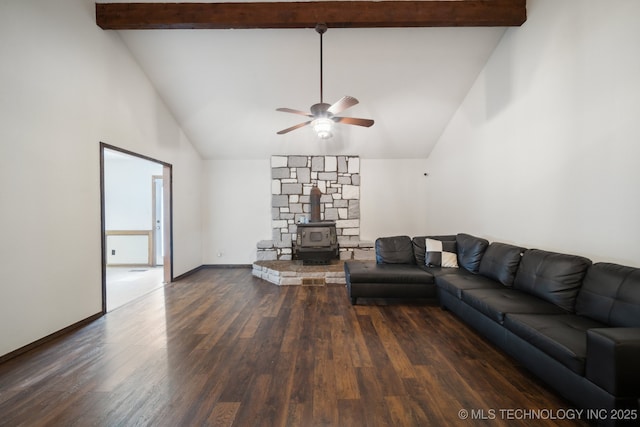 unfurnished living room featuring dark wood-type flooring, high vaulted ceiling, a wood stove, beamed ceiling, and ceiling fan