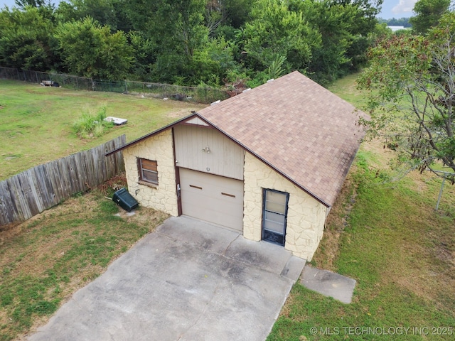 garage with a yard