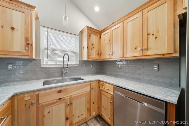 kitchen featuring lofted ceiling, sink, decorative light fixtures, dishwasher, and decorative backsplash