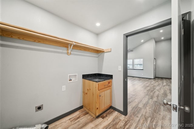 laundry room featuring washer hookup, light hardwood / wood-style floors, and hookup for an electric dryer