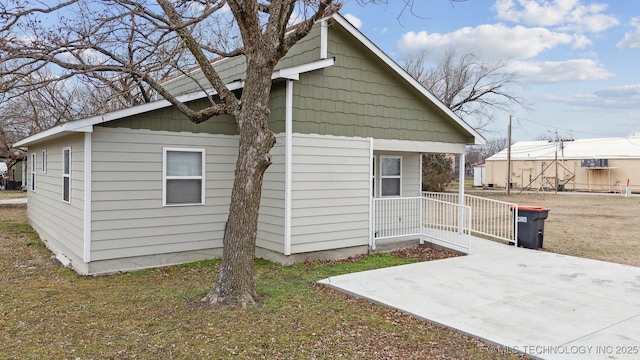 view of home's exterior featuring a yard and a patio