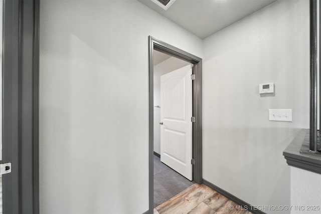 corridor with dark wood-type flooring