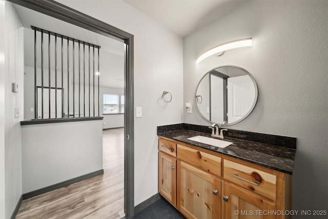 bathroom featuring vanity and hardwood / wood-style floors