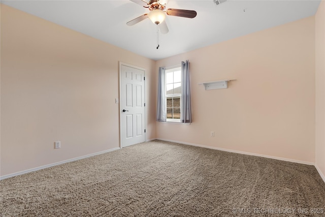 empty room with ceiling fan and carpet flooring