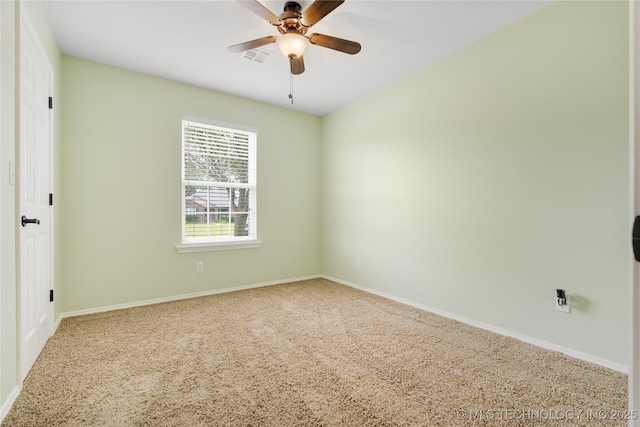 carpeted empty room featuring ceiling fan