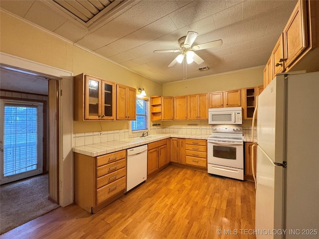 kitchen featuring sink, white appliances, ceiling fan, ornamental molding, and light hardwood / wood-style floors