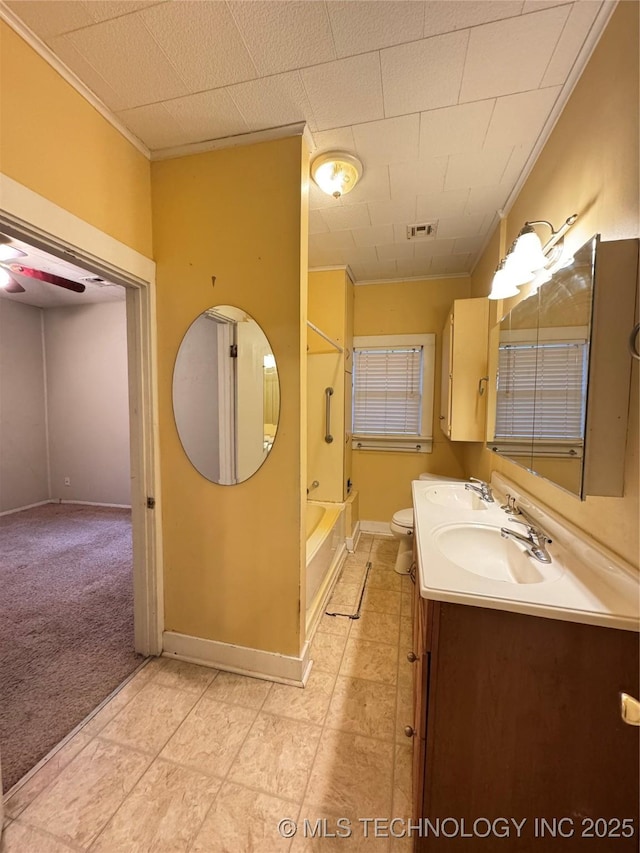 full bathroom with vanity, crown molding, bathing tub / shower combination, and toilet