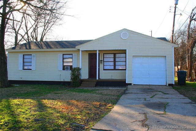 single story home with cooling unit and a garage