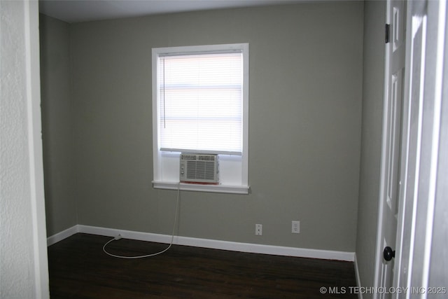 unfurnished room featuring dark hardwood / wood-style floors and cooling unit