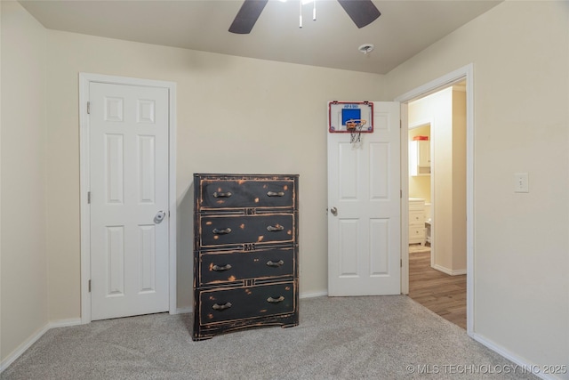 carpeted bedroom featuring ceiling fan