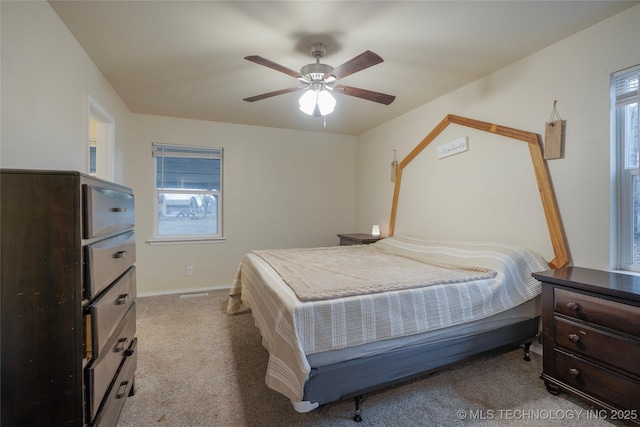 bedroom with light colored carpet and ceiling fan