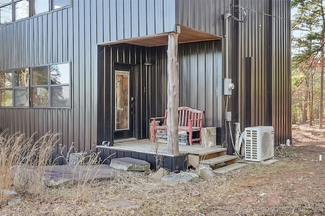 doorway to property with ac unit