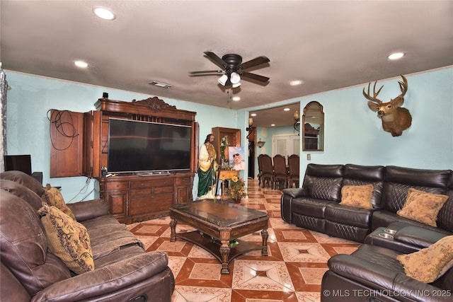 tiled living room with ceiling fan