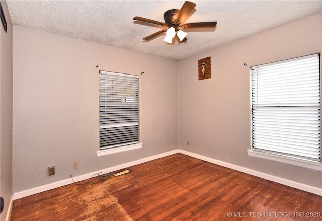 unfurnished room featuring dark hardwood / wood-style floors, a textured ceiling, and ceiling fan