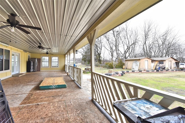 balcony with ceiling fan and french doors