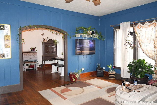 interior space featuring dark wood-type flooring and ceiling fan