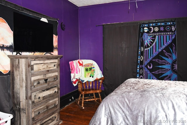 bedroom featuring dark hardwood / wood-style floors