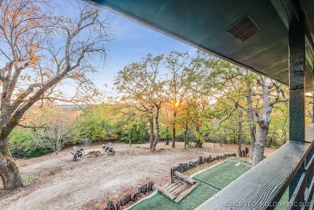 view of yard with an outdoor fire pit