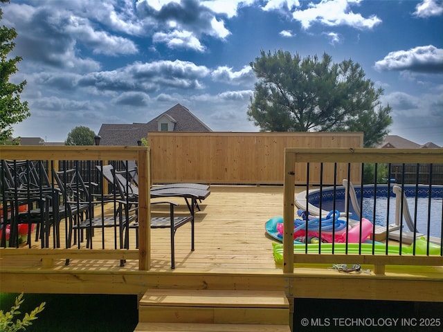 deck featuring a water view