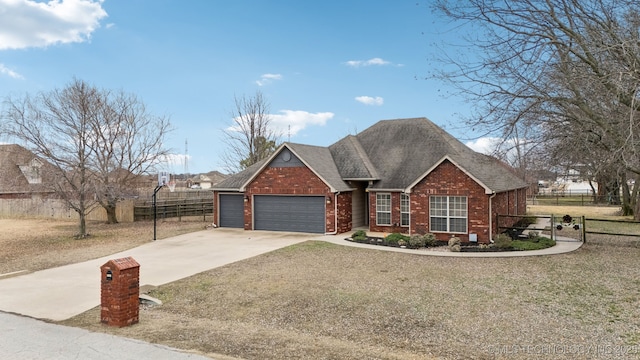 view of front facade with a garage and a front lawn