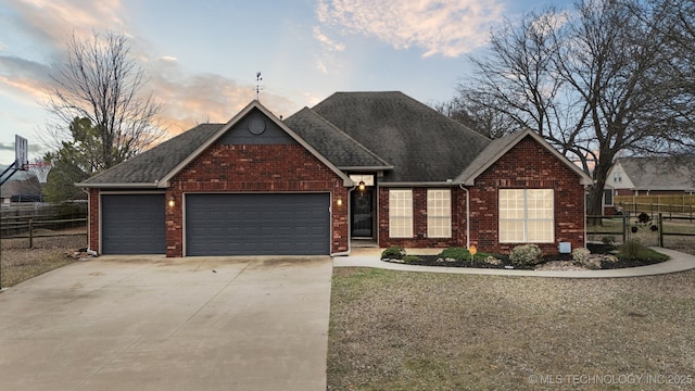 ranch-style house featuring a garage