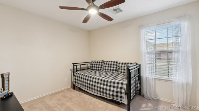 bedroom with light carpet and ceiling fan