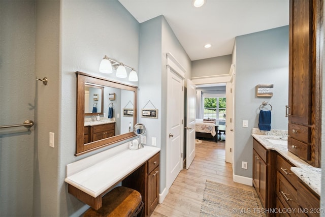 bathroom featuring vanity and wood-type flooring