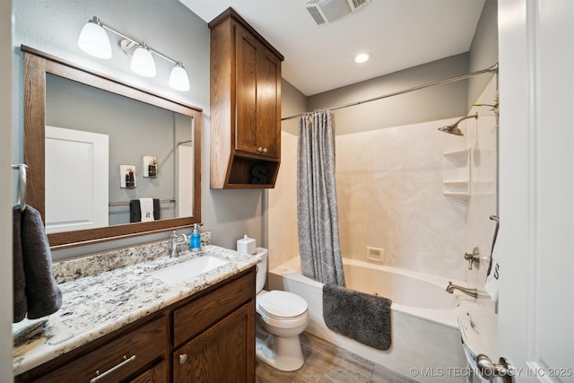 full bathroom with shower / bathtub combination with curtain, vanity, wood-type flooring, and toilet