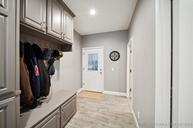 mudroom with light hardwood / wood-style floors