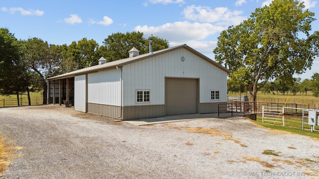 view of outdoor structure with a rural view