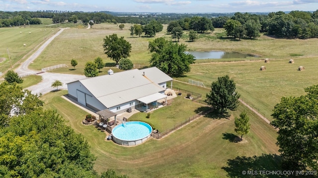 drone / aerial view featuring a water view and a rural view