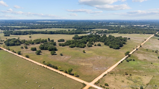 birds eye view of property featuring a rural view