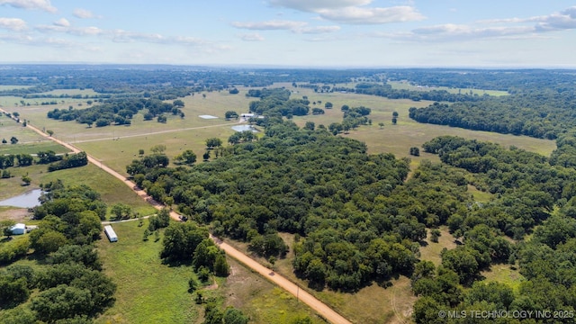 birds eye view of property with a rural view