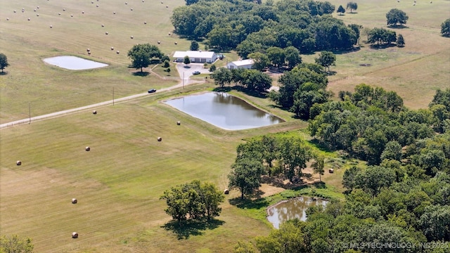 bird's eye view featuring a water view and a rural view