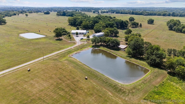 aerial view with a rural view and a water view