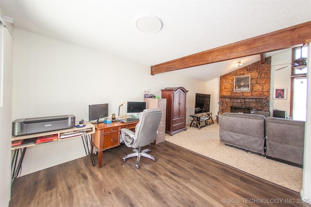 home office featuring hardwood / wood-style floors, a fireplace, and lofted ceiling with beams