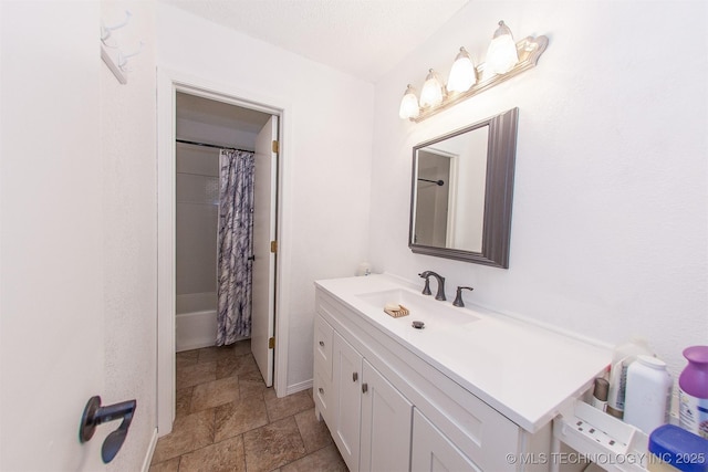 bathroom with vanity and shower / bath combo with shower curtain