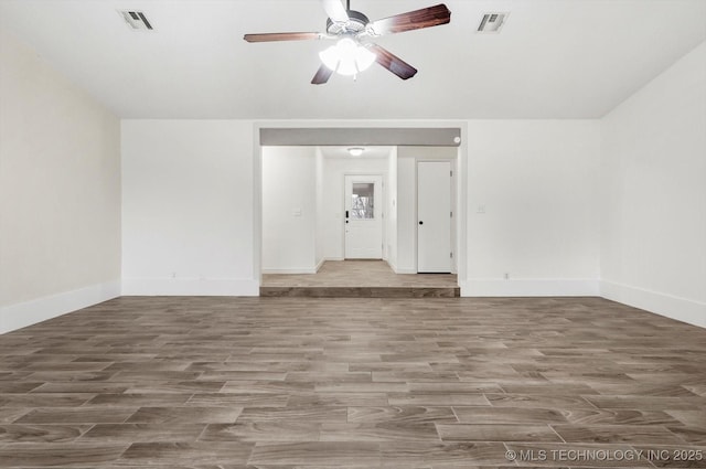 unfurnished living room with hardwood / wood-style flooring and ceiling fan