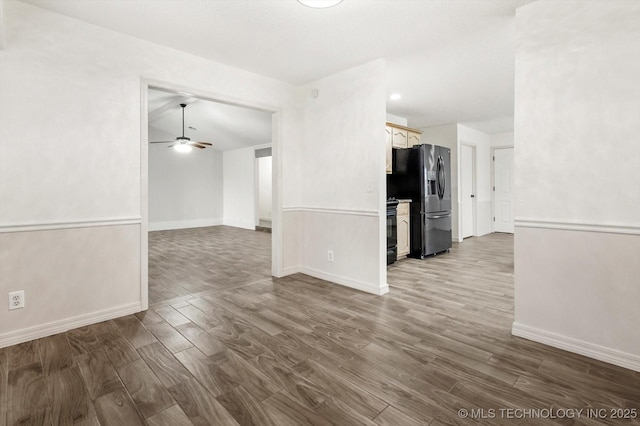 unfurnished living room with hardwood / wood-style flooring and ceiling fan