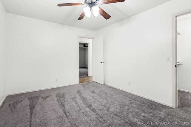 carpeted empty room featuring ceiling fan