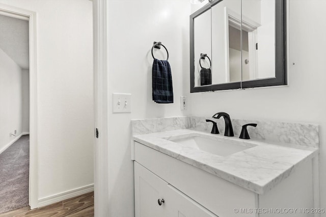 bathroom featuring vanity and hardwood / wood-style flooring