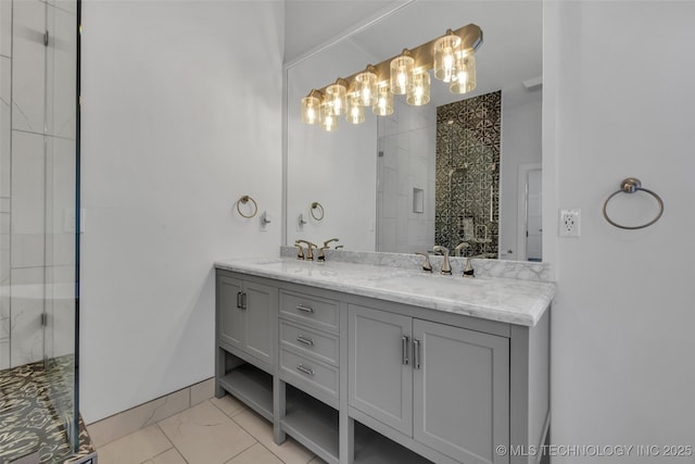 bathroom featuring a shower with door and vanity