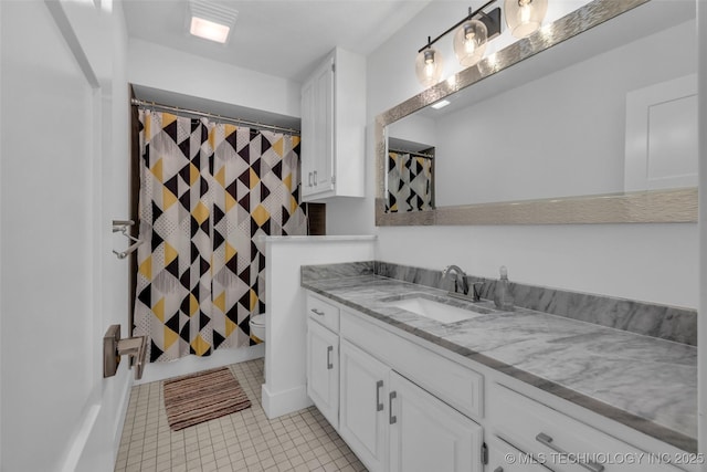 bathroom with vanity, tile patterned floors, toilet, and a shower with shower curtain