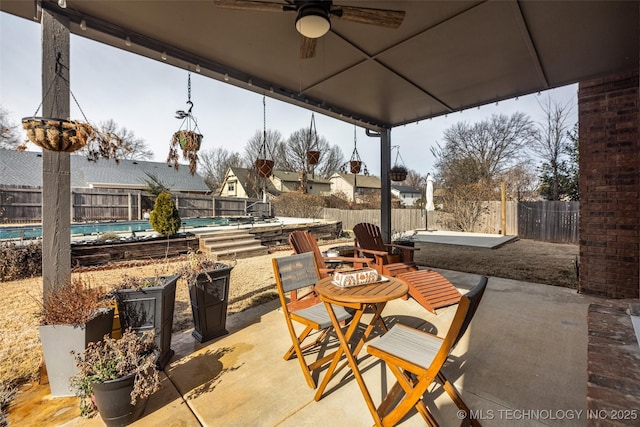 view of patio / terrace featuring a fenced in pool