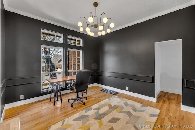 office with crown molding, a notable chandelier, and hardwood / wood-style flooring