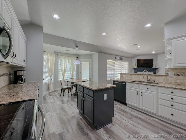 kitchen with white cabinetry, sink, and appliances with stainless steel finishes