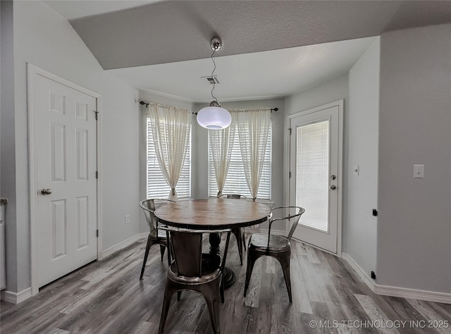 dining space featuring hardwood / wood-style floors